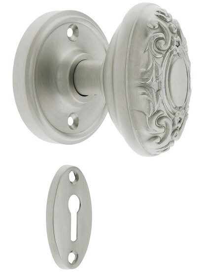Classic Rosette Mortise Lock Set With Decorative Oval Knobs in Satin Nickel finish.